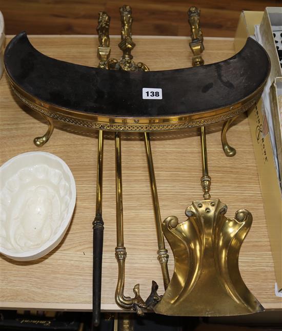 A lion handled fire irons & foot stand